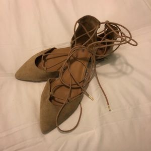 Lace up nude suede flats with gold accents